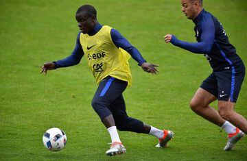 Kante (left) runs with the ball during France training as Les Bleus prepare for Euro 2016.