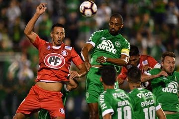 Douglas (R) of Brazil's Chapecoense, vies for the ball with Christian Vilches (L) of Chile's Union La Calera, during their 2019 Copa Sudamericana football match held at Arena Conda stadium, in Chapeco, Brazil, on February 19, 2019. (Photo by NELSON ALMEIDA / AFP)