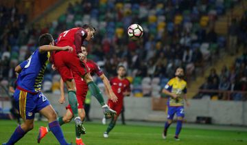 Portugal's Cristiano Ronaldo heads the ball to score his second goal against Andorra.