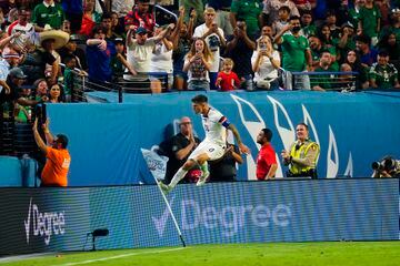 Christian Pulisic celebrates after scoring against Mexico.