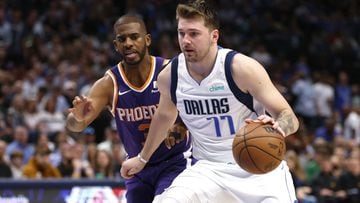 DALLAS, TX - MAY 6: Luka Doncic #77 of the Dallas Mavericks handles the ball as Chris Paul #3 of the Phoenix Suns defends during the second half of Game Three of the 2022 NBA Playoffs Western Conference Semifinals at American Airlines Center on May 6, 2022 in Dallas, Texas. The Mavericks won 103-94. NOTE TO USER: User expressly acknowledges and agrees that, by downloading and or using this photograph, User is consenting to the terms and conditions of the Getty Images License Agreement.   Ron Jenkins/Getty Images/AFP
== FOR NEWSPAPERS, INTERNET, TELCOS & TELEVISION USE ONLY ==