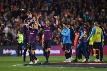 Barça players celebrate after beating Levante 1-0 to claim the title.