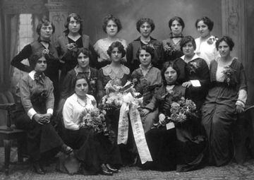 Women of the Reliance Waist Company, many wearing a corsage, pose for a group photo with a flower bouquets including ribbons that read "Good Luck" and "Your Friends." Photo courtesy of the Kheel Center, Cornell University.