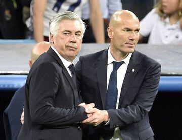 In this file photo taken on April 18, 2017, Carlo Ancelotti, then coach of Bayern Munich, shakes hands with Zinedine Zidane after the UEFA Champions League quarter-final second leg between Real Madrid and Bayern Munich at the Santiago Bernabeu.