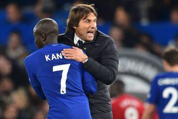 Chelsea's Italian head coach Antonio Conte celebrates on the pitch with N'Golo Kante in the win over Manchester United.