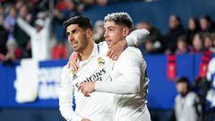 PAMPLONA, SPAIN - FEBRUARY 18: Federico Valverde of Real Madrid celebrates after scoring the team's first goal with teammate Marco Asensio during the LaLiga Santander match between CA Osasuna and Real Madrid CF at El Sadar Stadium on February 18, 2023 in Pamplona, Spain. (Photo by Juan Manuel Serrano Arce/Getty Images)