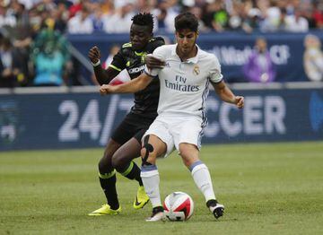 Real Madrid's Marco Asensio in action with Chelsea's Bertrand Traore