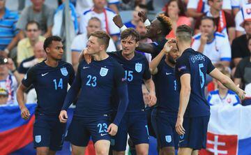Alfie Mawson of England celebrates scoring his team's first goal against Slovakia.