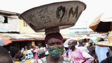 A woman wears a locally made face mask at a food market in Nigeria&#039;s commercial capital Lagos, Nigeria, 04 May 2020. 
