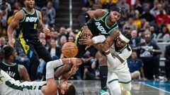 Nov 9, 2023; Indianapolis, Indiana, USA; Indiana Pacers guard Buddy Hield (7) and Milwaukee Bucks forward Jae Crowder (99) fight for a loose ball in the first half at Gainbridge Fieldhouse. Mandatory Credit: Trevor Ruszkowski-USA TODAY Sports