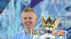 FILE PHOTO: Soccer Football - Premier League - Manchester City v Everton - Etihad Stadium, Manchester, Britain - May 23, 2021 Manchester City's Oleksandr Zinchenko poses with the trophy as he celebrates after winning the Premier League Pool via REUTERS/Peter Powell EDITORIAL USE ONLY. No use with unauthorized audio, video, data, fixture lists, club/league logos or 'live' services. Online in-match use limited to 75 images, no video emulation. No use in betting, games or single club /league/player publications.  Please contact your account representative for further details./File Photo