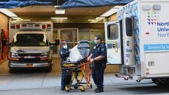 Paramedics prepare a gurney at Mt. Sinai Hospital on April 1, 2020 in New York. - The US on Wednesday has surpassed 200,000 confirmed cases of the novel coronavirus, according to a tally kept by Johns Hopkins University. (Photo by Angela Weiss / AFP)