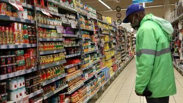 A shopper wearing a face mask looks at grocery items amid the spread of the coronavirus disease at mall in Johannesburg, South Africa.
