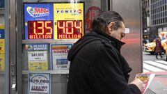 NEW YORK, USA - JANUARY 12: Mega Millions sign and lottery tickets are seen at a store in New York, United States on January 12, 2023. Today's Mega Millions jackpot hits $1.35 billion as its 2nd largest in history. (Photo by Fatih Aktas/Anadolu Agency via Getty Images)