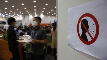 Seoul (Korea, Republic Of), 20/05/2020.- A sign showing the risks of not wearing a mask hangs from the door of the cafeteria of Seoul city hall in Seoul, South Korea, 20 May 2020. Countries around the world are taking increased measures to stem the widesp