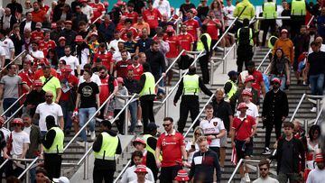 Manchester United fans leave Wembley Stadium in London after the FA Cup final football match between Manchester City and Manchester United on June 3, 2023. Manchester City beat Manchester United 2-1 at Wembley to keep their treble dream alive. (Photo by HENRY NICHOLLS / AFP)