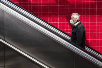A man wearing a face mask exits the subway at the Alvarado Street metro station amid the coronavirus pandemic in Los Angeles, California.