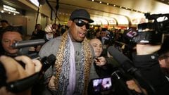 Former NBA basketball player Dennis Rodman speaks to the media after returning from his trip to North Korea at Beijing airport, December 23, 2013. REUTERS/Jason Lee (CHINA - Tags: POLITICS SPORT TPX IMAGES OF THE DAY)