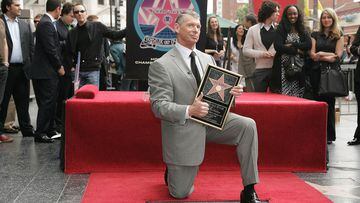 (FILES) In this file photo taken on March 14, 2008 WWE Chairman Vince McMahon attends a ceremony honoring him with a star on the Hollywood Walk of Fame at Hollywood and Highland in Hollywood, California. - Vince McMahon, the promoter who built a pro wrestling show into a global entertainment empire, Friday announced he was retiring as head of World Wrestling Entertainment -- under a cloud of serious sexual misconduct allegations.
McMahon, whose friends include former US president Donald Trump, became a character in his own wrestling promotions at one stage and even launched a rival to the NFL -- his over-the-top XFL. (Photo by Neilson Barnard / GETTY IMAGES NORTH AMERICA / AFP)
