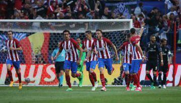Atlético's players celebrate Saúl's headed opener.