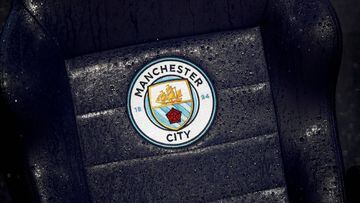 FILE PHOTO: Soccer Football - Premier League - Manchester City v West Ham United - Etihad Stadium, Manchester, Britain - February 19, 2020  General view of a Manchester City badge on a rain soaked seat before the match   REUTERS/Phil Noble  EDITORIAL USE 