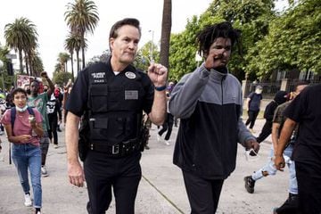 LAPD Commander Cory Palka and a protester
