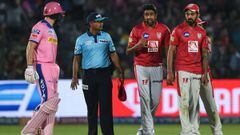 (FILES) In this file photo taken on March 25, 2019 Rajasthan Royals&#039; Jos Buttler (L) exchanges words with Kings XI Punjab&#039;s Ravichandran Ashwin (2ndR) during the 2019 Indian Premier League (IPL) Twenty20 cricket match between Rajasthan Royals an