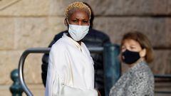 Nicole Coste, wearing a protective face mask, arrives at Monaco cathedral during the traditional Sainte Devote procession in Monaco, January 27, 2022.   