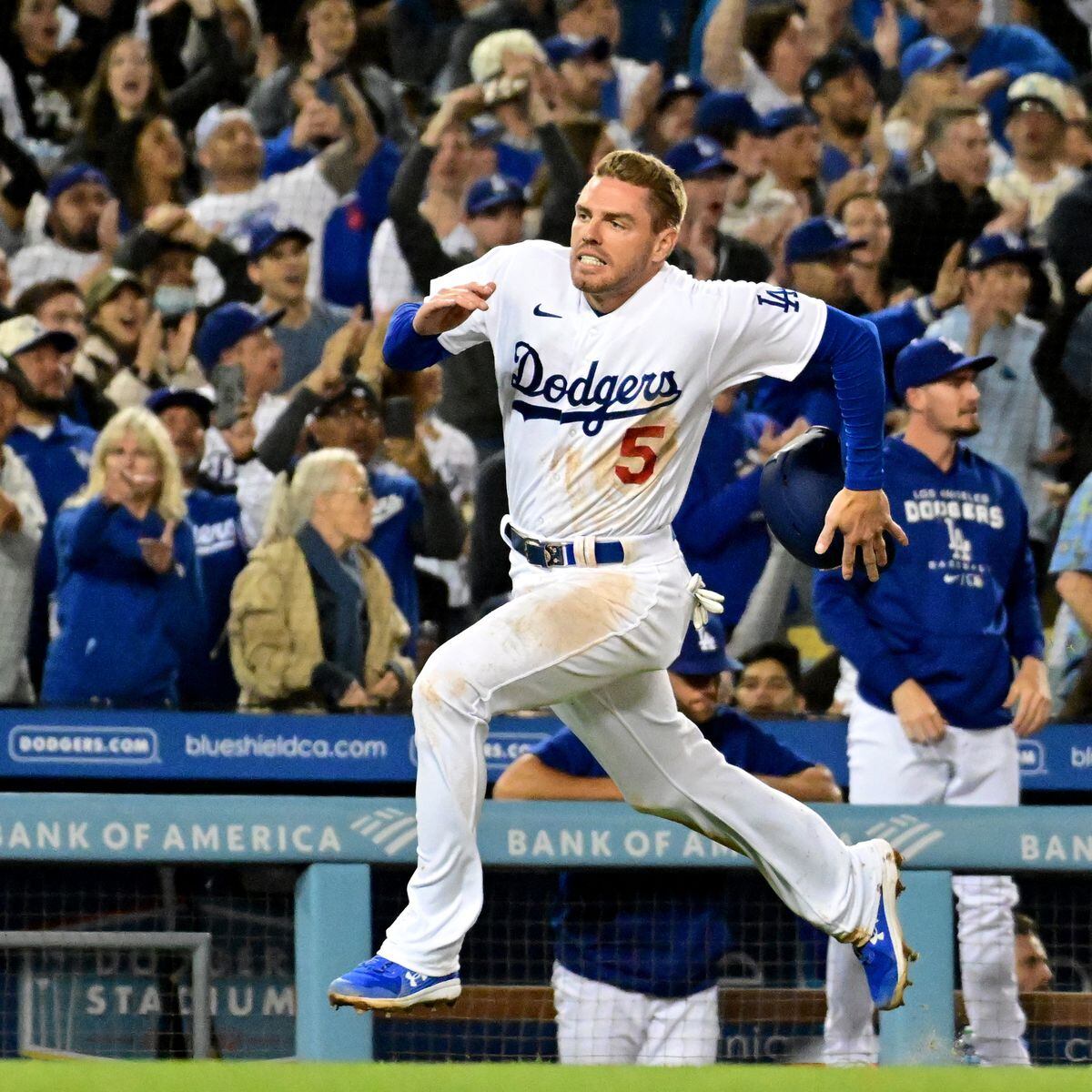 Los Angeles Dodgers' Justin Turner, right, smiles at Freddie