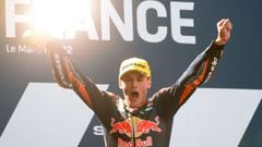 Red Bull KTM Ajo Spanish rider Masia Jaume celebrates on the podium after winning the Moto 3 race at the French Moto GP Grand Prix, at the Bugatti circuit in Le Mans, northwestern France, on May 15, 2022. (Photo by JEAN-FRANCOIS MONIER / AFP)