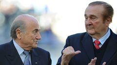 (FILES) This file picture taken on July 23, 2011 shows FIFA President, Sepp Blatter (L), and CONMEBOL President, Nicolas Leoz, before the start of the 2011 Copa America football tournament third-place match between Peru and Venezuela at the Ciudad de La Plata stadium in La Plata, Buenos Aires Province.
 .
 While the FifaGate trial began in New York on November 13, 2017, the South American football boss heavily implicated in a US-led investigation into corruption in world football Leoz, spends his days at home on his Asuncion property under house arrest fighting extradition. The international arrest warrant issued by the US justice has no chance of reaching the 1986-2013 Conmebol president.  / AFP PHOTO / Juan MABROMATA