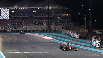 ABU DHABI, UNITED ARAB EMIRATES - DECEMBER 12: Race winner Max Verstappen of the Netherlands driving the (33) Red Bull Racing RB16B Honda takes the chequered flag during the F1 Grand Prix of Abu Dhabi at Yas Marina Circuit on December 12, 2021 in Abu Dhab