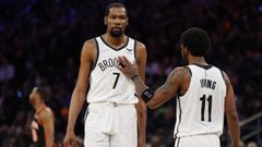 NEW YORK, NEW YORK - APRIL 06: Kyrie Irving #11 reacts with Kevin Durant #7 of the Brooklyn Nets during the second half against the New York Knicks at Madison Square Garden on April 06, 2022 in New York City. The Nets won 110-98. NOTE TO USER: User expres