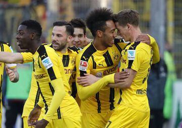 Dortmund's Pierre-Emerick Aubameyang celebrates after scoring the 3-0 goal lead with Erik Durm against SC Freiburg.