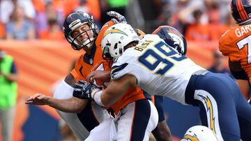Oct 30, 2016; Denver, CO, USA; San Diego Chargers defensive end Joey Bosa (99) hits Denver Broncos quarterback Trevor Siemian (13) after a pass in the first half at Sports Authority Field at Mile High. Mandatory Credit: Ron Chenoy-USA TODAY Sports