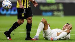 Nassr's Portuguese forward Cristiano Ronaldo reacts while on the ground during the Saudi Pro League football match between al-Ittihad and al-Nassr at King Abdullah Sport City Stadium in Jeddah on March 9, 2023. (Photo by AFP)