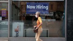 A hiring sign is displayed in a store window in Manhattan on August 19, 2021 in New York City. 