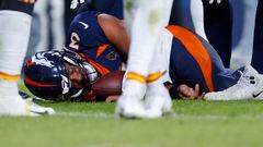DENVER, COLORADO - DECEMBER 11: Russell Wilson #3 of the Denver Broncos lies on the field after sustaining a concussion in the fourth quarter of a game against the Kansas City Chiefs at Empower Field At Mile High on December 11, 2022 in Denver, Colorado.   Justin Edmonds/Getty Images/AFP (Photo by Justin Edmonds / GETTY IMAGES NORTH AMERICA / Getty Images via AFP)