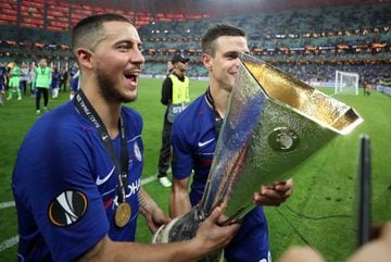 Hazard (left) celebrates Chelsea's Europa League win with Blues team-mate César Azpilicueta.