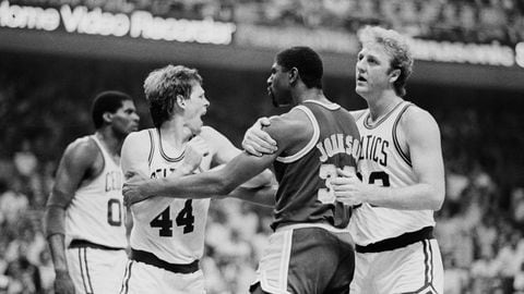 Boston Celtics' basketball player Larry Bird restraining Los Angeles Lakers' Magic Johnson from punching Celtics' Danny Ainge. Tempers flared during the third quarter of game one of the NBA Championship at the Fleet Center in Boston on May 27, 1995.