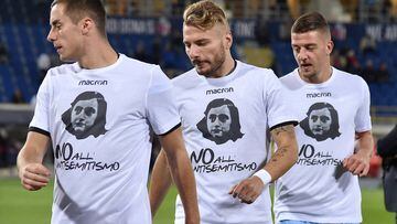 FILE PHOTO: Lazio&#039;s players Ciro Immobile (C), Adam Marusic (L) and Sergej Milinkovic-Savic wear a shirt with a picture of Anne Frank before their Serie A soccer match against Bologna at the Dall&#039;Ara stadium in Bologna, Italy October 25, 2017. P