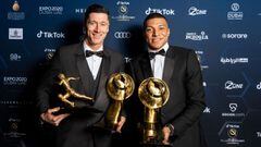 This handout picture made available by the Dubai Globe Soccer Awards on December 27, 2021 shows (L to R) Polish footballer Robert Lewandowski posing for a photo with his awards &quot;Maradona Award for Best Goal Scorer of the Yea&quot; and the &quot;TikTok Fans Player of the Year&quot;; alongside French footballer Kylian Mbappe, winner of the &quot;Best Men&#039;s Player of the Year&quot; award during the 2021 Globe Soccer Awards at the Burj Khalifa in the gulf emirate. (Photo by Elmer MAGALLANES / Dubai Globe Soccer Awards / AFP) / === RESTRICTED TO EDITORIAL USE - MANDATORY CREDIT &quot;AFP PHOTO / HO / Dubai Globe Soccer Awards&quot; - NO MARKETING NO ADVERTISING CAMPAIGNS - DISTRIBUTED AS A SERVICE TO CLIENTS ===