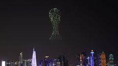 A drone show depicting the World Cup trophy is seen above the Doha skyline, ahead of the FIFA World Cup 2022 soccer tournament in Doha, Qatar November 14, 2022. REUTERS/Amr Abdallah Dalsh