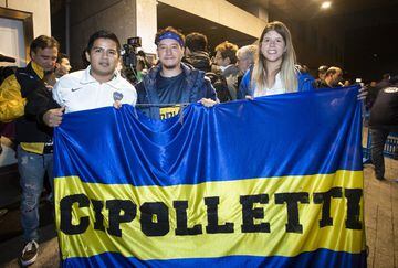 Boca Juniors fans await the team's arrival in Madrid.