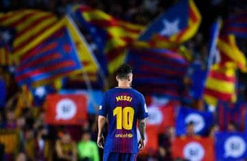 Lionel Messi of FC Barcelona looks on as Catalan Pro-Independence flags are seen on the background during the La Liga match between Barcelona and SD Eibar at Camp Nou on September