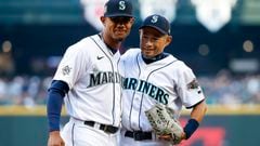 Apr 15, 2022; Seattle, Washington, USA; Seattle Mariners center fielder Julio Rodriguez (left) embraces former outfielder Ichiro Suzuki following a ceremonial first pitch by Suzuki before a game against the Houston Astros at T-Mobile Park. Mandatory Credit: Joe Nicholson-USA TODAY Sports