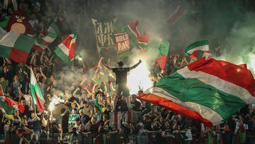 Lokomotiv Moscow fans wave flags and set off firecrackers as they root for their team during the 2017 Russian Super Cup football match against Spartak Moscow at Lokomotiv Stadium. 