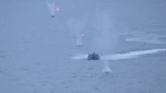 A still image from video, released by Russia's Defence Ministry, shows what it said to be the Ukrainian uncrewed speedboat attacking the Russian warship Ivan Khurs in the Black Sea near the Bosphorus strait, in this image taken from handout footage released May 24, 2023. Russian Defence Ministry/Handout via REUTERS ATTENTION EDITORS - THIS IMAGE WAS PROVIDED BY A THIRD PARTY. NO RESALES. NO ARCHIVES. MANDATORY CREDIT.