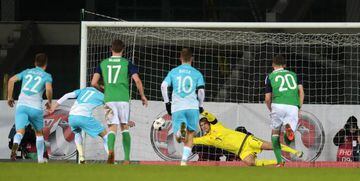 BELFAST, NORTHERN IRELAND - MARCH 28: Roy Carroll of Northern Ireland saves a penalty from Novakovic Milivoje of Slovenia during the international friendly between Northern Ireland and Slovenia at Windsor Park on March 28, 2016 in Belfast, Northern Irelan