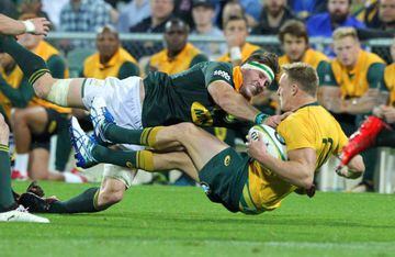 Reece Hodge of Australia is tackled by Jaco Kriel of South Africa.